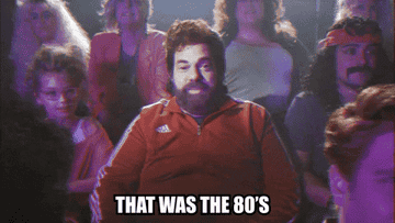 A person with a mullet and a tracksuit says "that was the '80s"