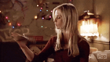 Buffy twirls a stake around in her hand like a total badass