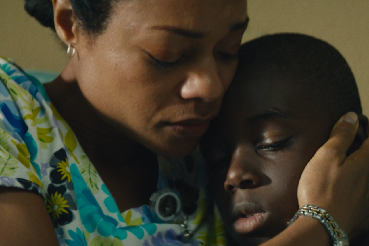 Naomie Harris hugs her child in Moonlight