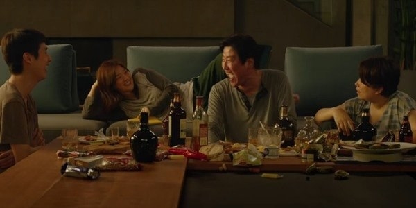 The Kim family laughing and eating