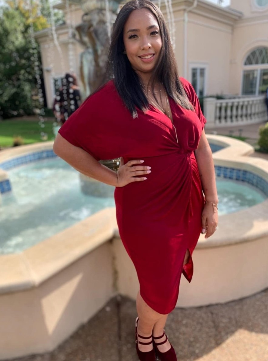 Reviewer posing in red short-sleeve dress