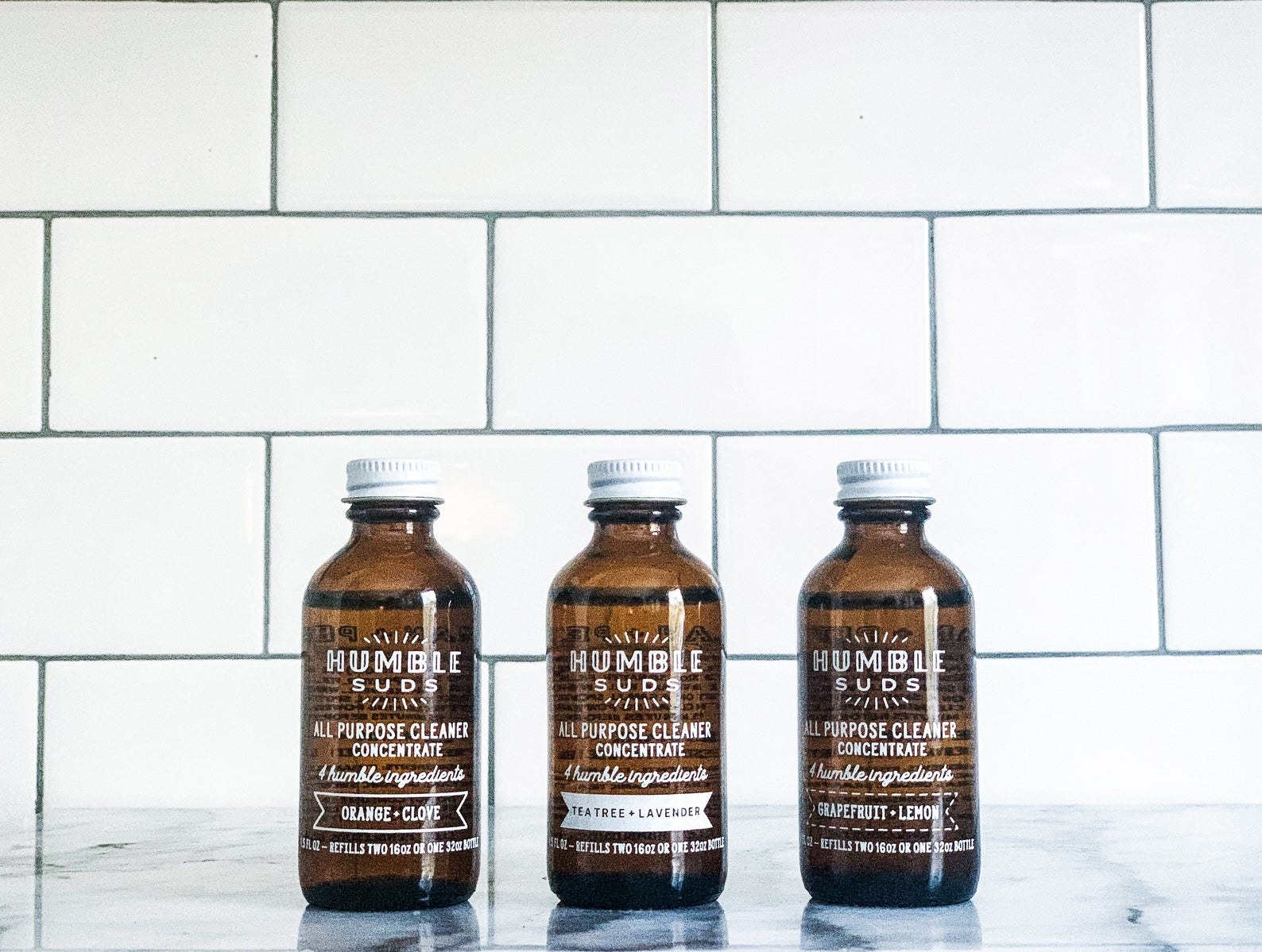three bottles of the cleaner concentrate