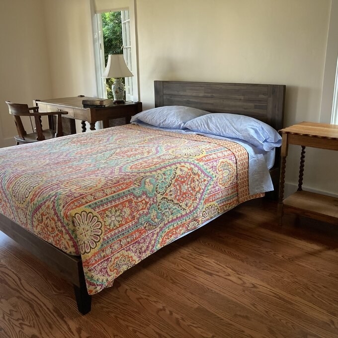 A reviewer&#x27;s rustic wooden platform bed