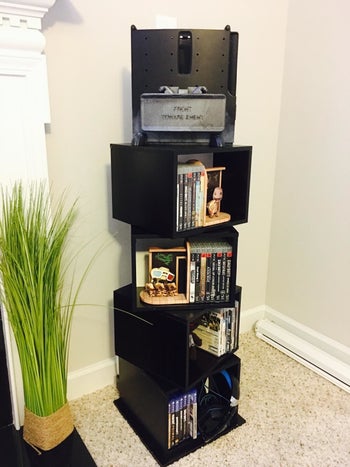 a reviewer's storage cubes holding DVDs and trinkets
