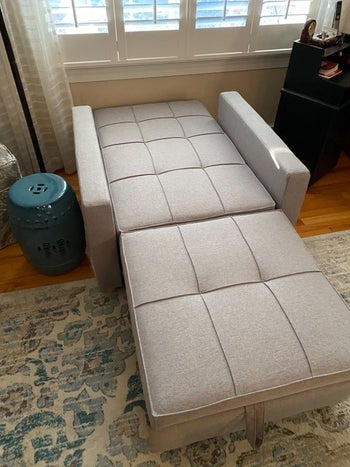 a different reviewer's chair unfolded into a mattress