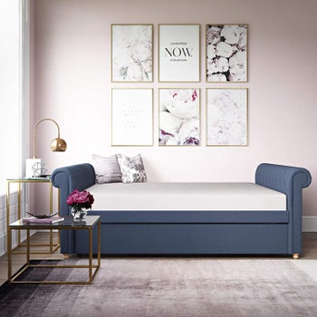 the navy bed with the trundle stowed away