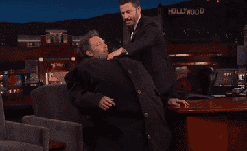 Jimmy Kimmel unbuttons Ben Affleck&#x27;s sweater to reveal Matt Damon