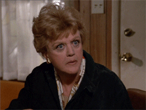 GIF of Angela Lansbury from Murder She Wrote, eating popcorn and looking very inerested