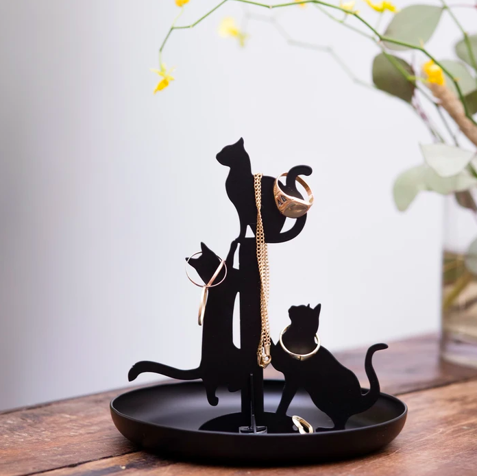 The cat jewellery stand covered in baubles