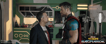 Thor and Bruce Banner half fist bumping half high fiving in &quot;Thor Ragnarok&quot;