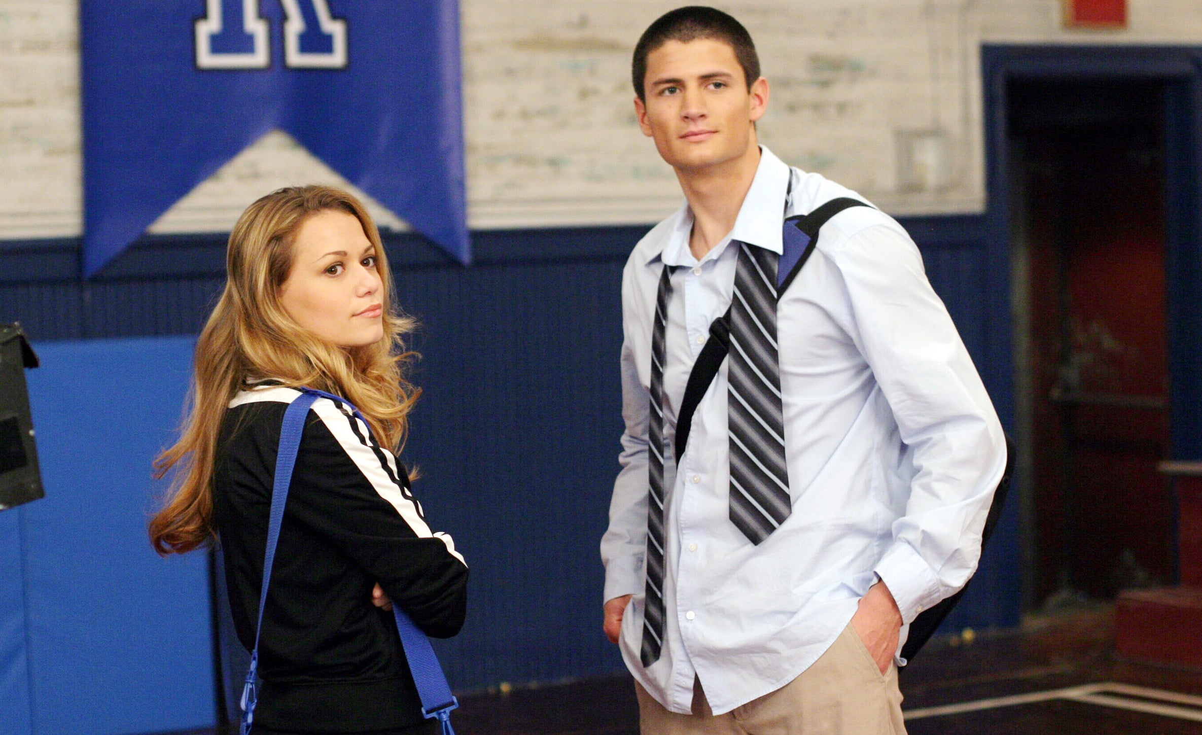 Haley and Nathan standing together but not looking at each other