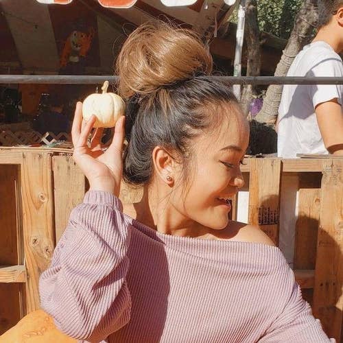 model with messy bun in toffee brown 