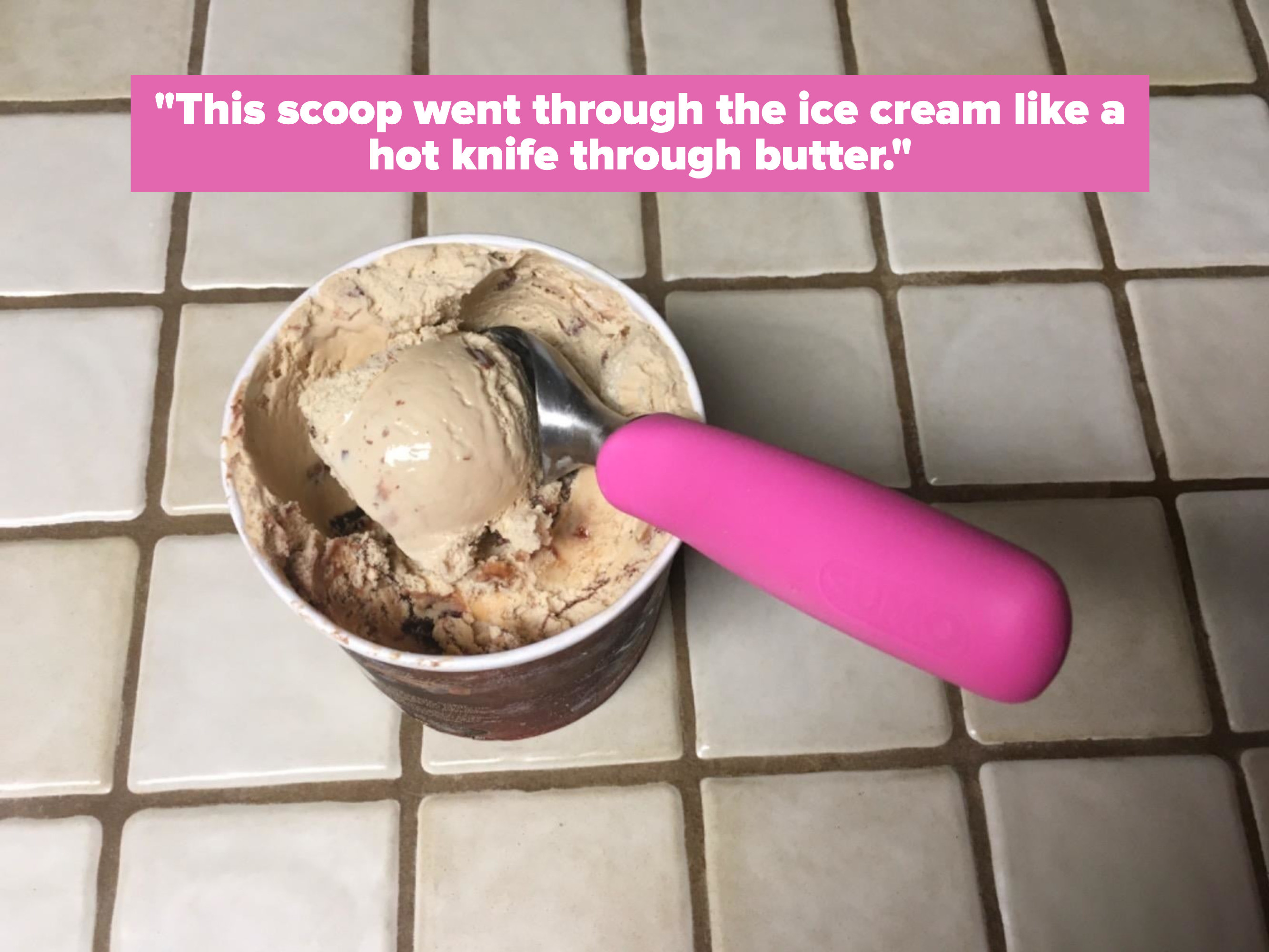 The pink scoop scooping out ice cream with reviewer text 