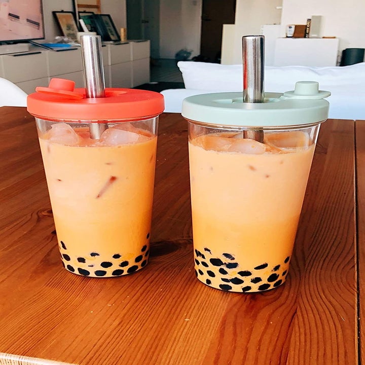 Two cups filled with boba