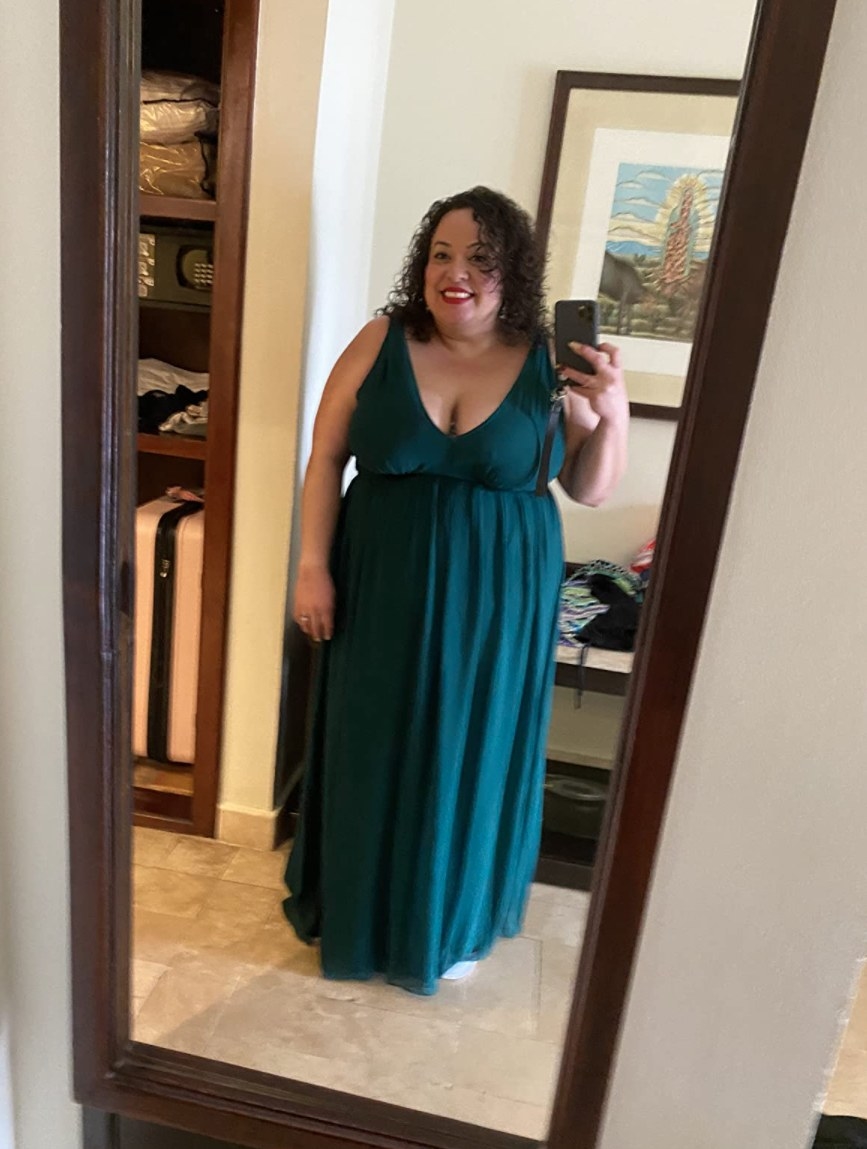Reviewer taking mirror selfie in teal v-neck sleeveless maxi dress 