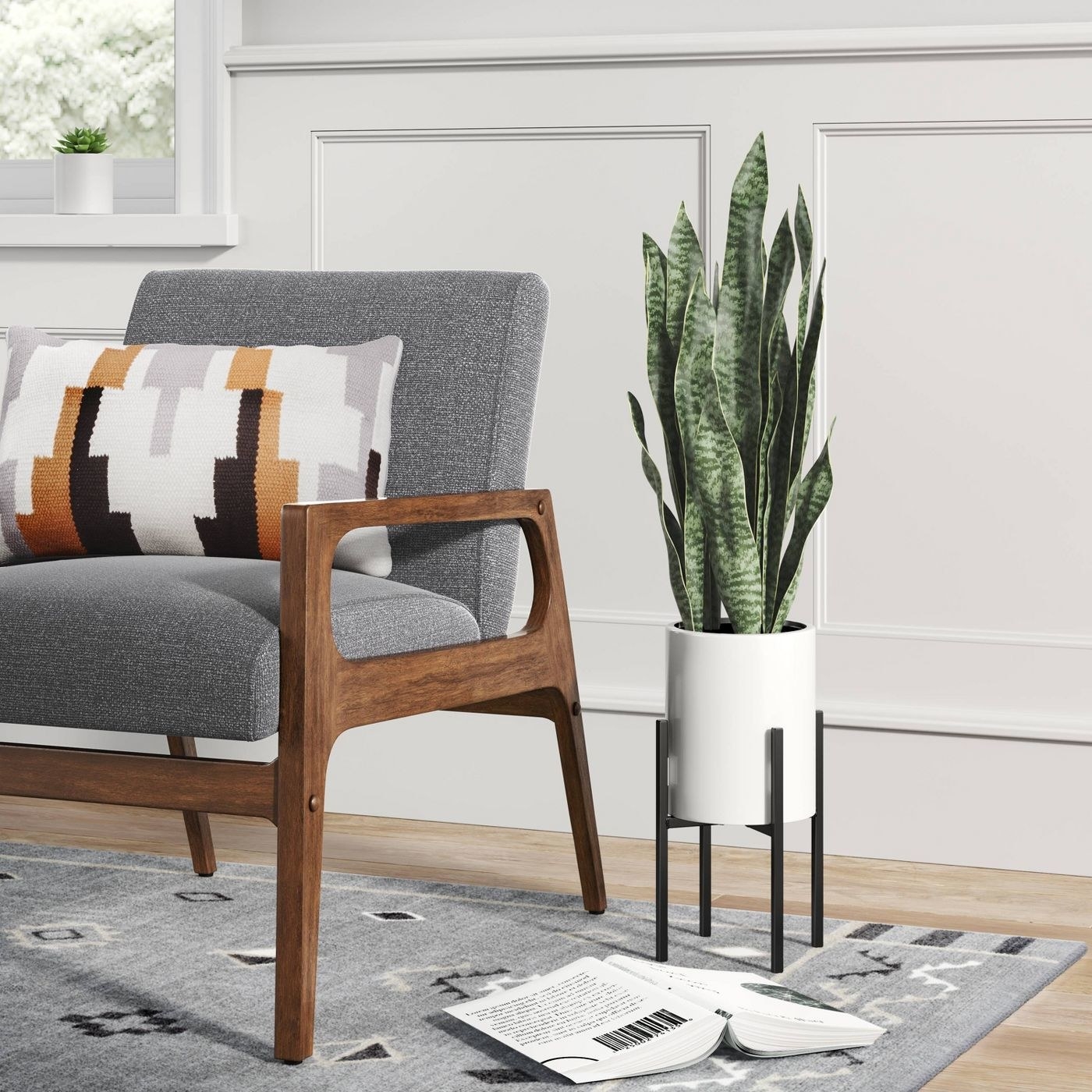 An artificial snake plant in a white stand with black legs in a living room