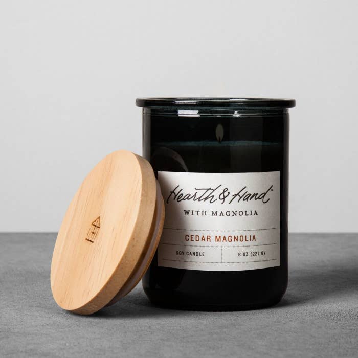 A scented candle in a black jar