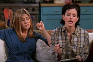Rachel and Monica are sitting on a couch writing a list