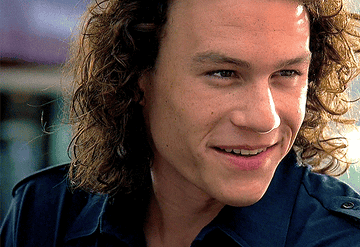 Heath Ledger smiling and then winking