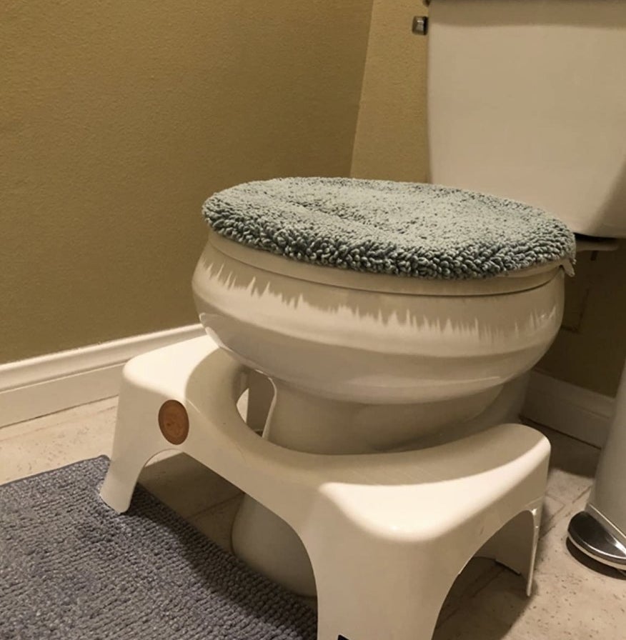 reviewer photo showing the squatty potty against their toilet