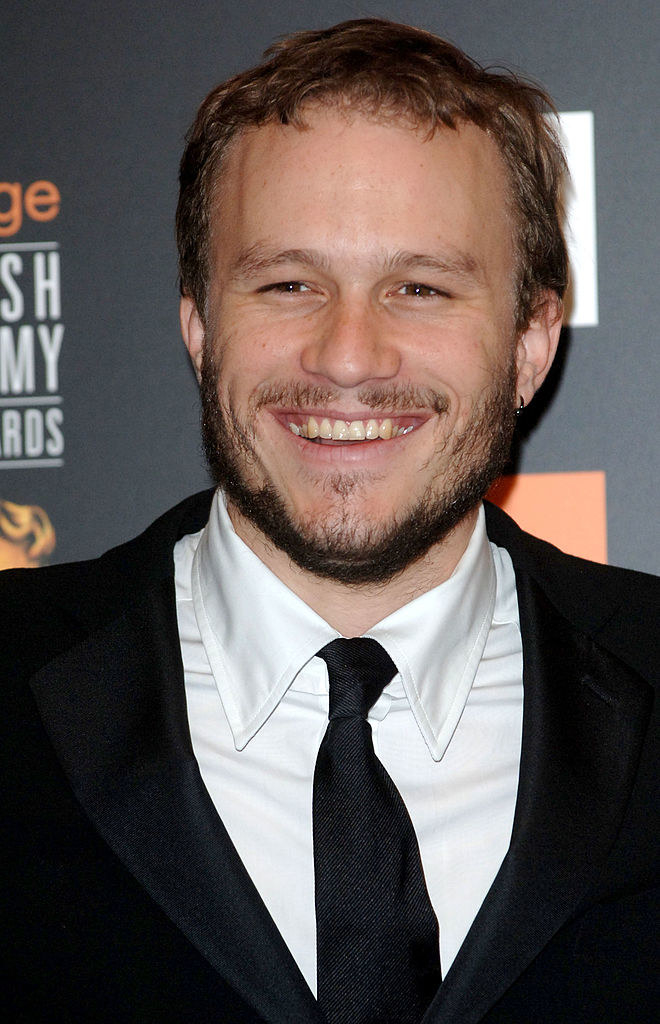 Heath Ledger at a premiere smiling at the camera