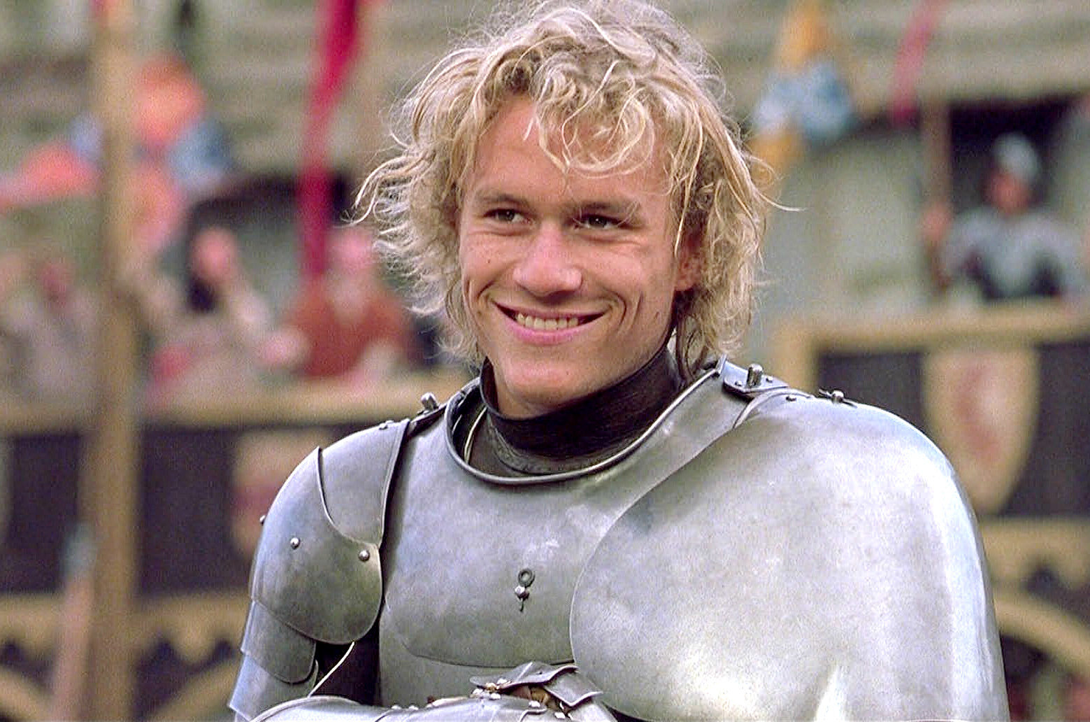 Heath Ledger in A Knight&#x27;s Tale; he is wearing a suit of armour and smiling