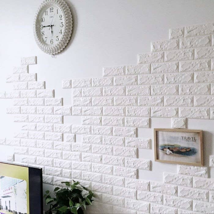 A foamy, white brick wallpaper on a wall.