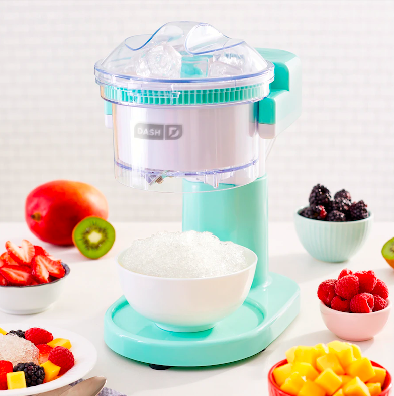 The shaved ice maker surrounded by fruit