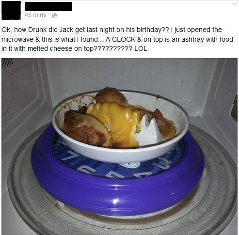 drunk person who cooks food on a clock in the microwave