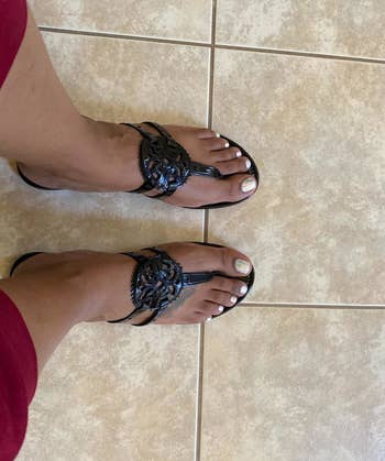 a different reviewer wearing the sandals in black