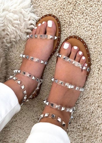 a different reviewer wearing the clear strapped sandals