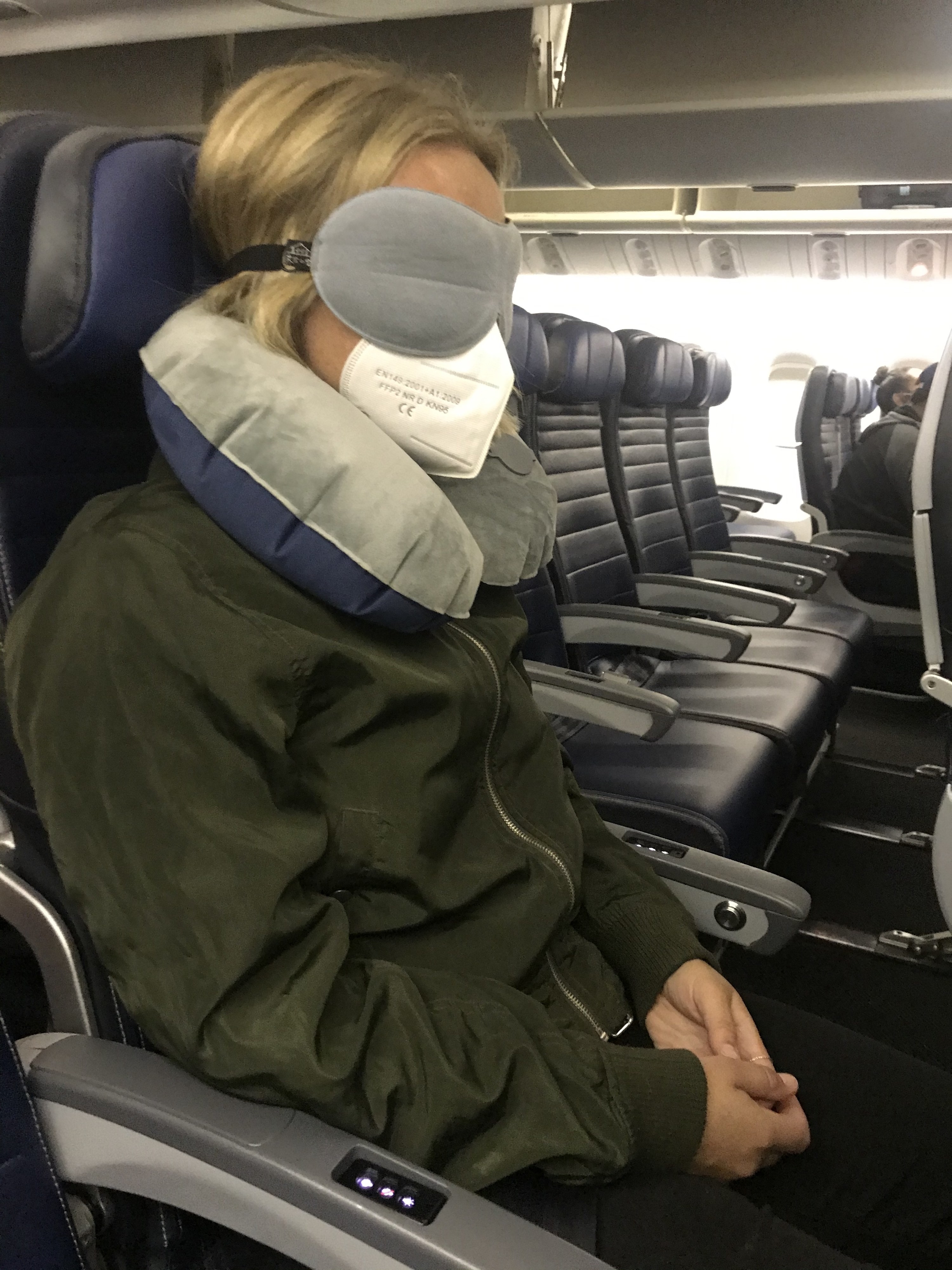 Woman asleep on a plane