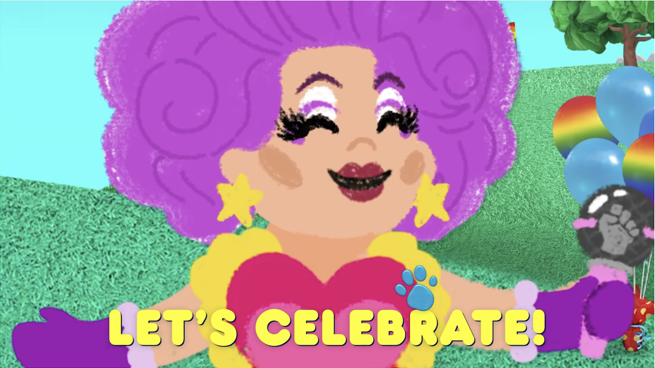 Nina West in the parade saying &quot;let&#x27;s celebrate!&quot; 