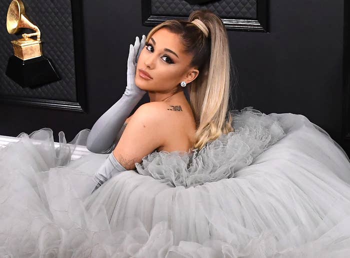 Ariana shows off her back tattoo while posing in a tutu dress at the Grammys