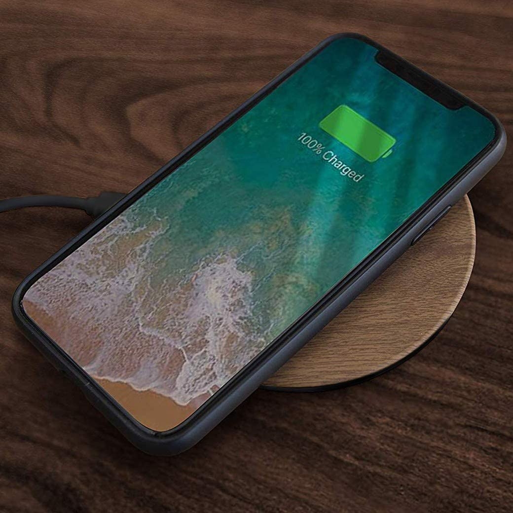 a phone on the wood charger