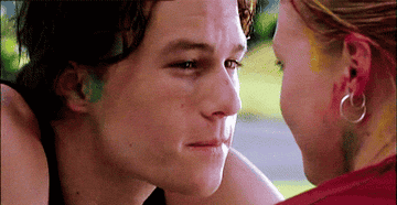 Heath Ledger in 10 Things I Hate About You; he is looking at Kat before he breaks into a smile