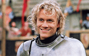Heath Ledger in A Knight&#x27;s Tale; he is wearing a suit of armour and smiling before he winks