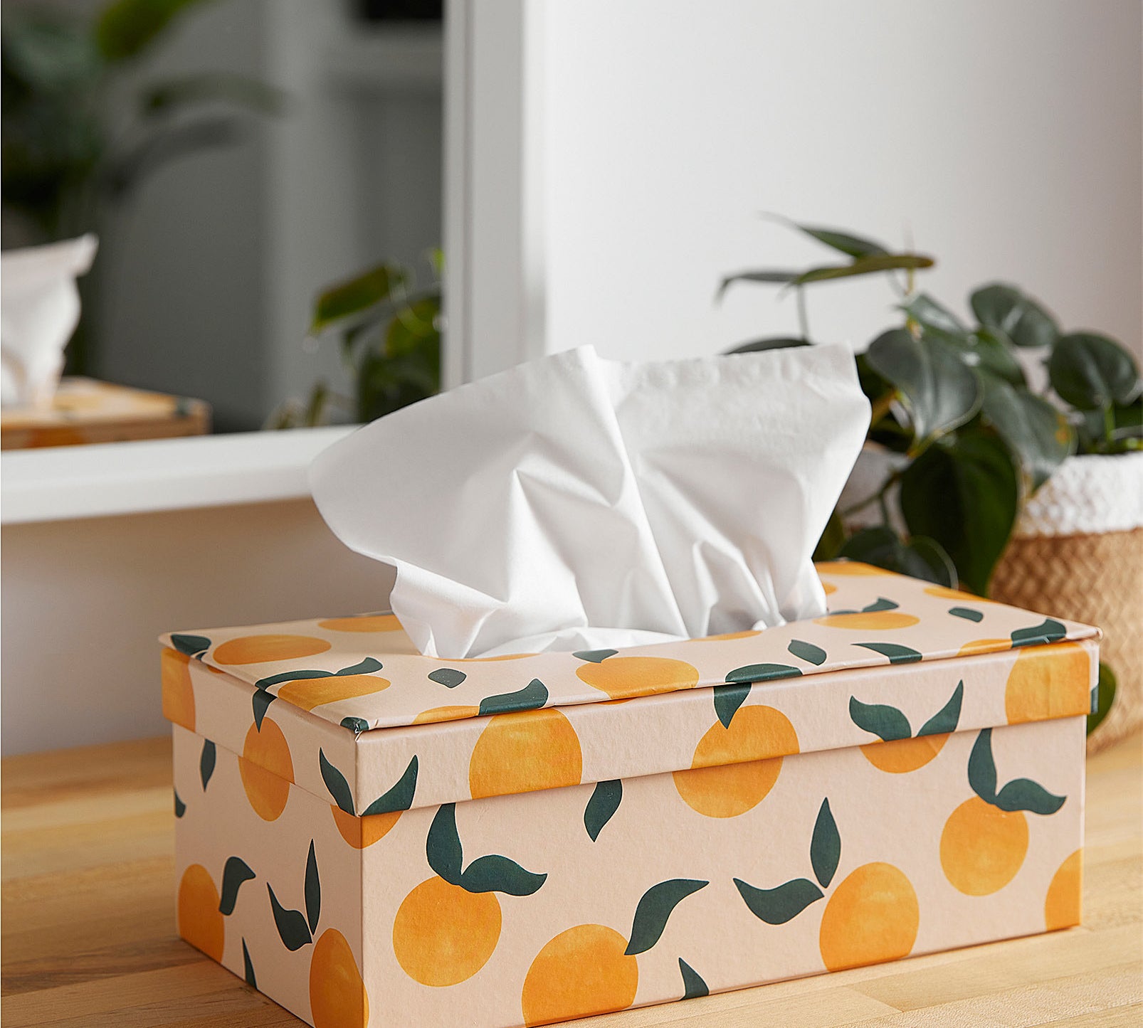 A tissue box on a wooden table