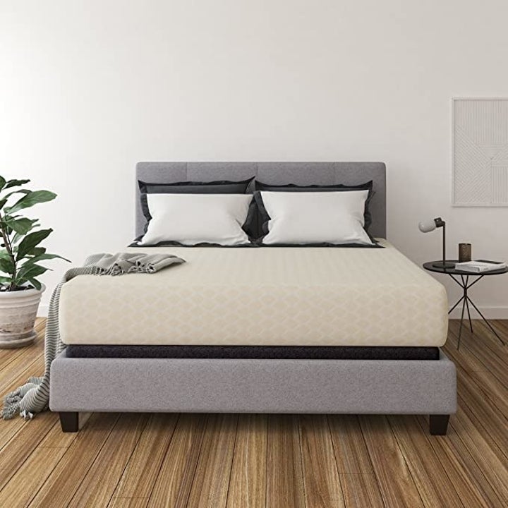 a king-sized mattress on a bed frame