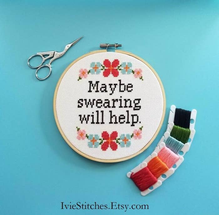 completed cross stitch with a floral design that says &quot;maybe swearing will help&quot; 