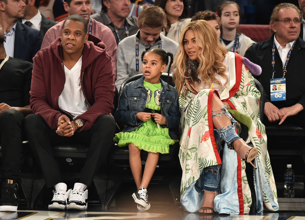  (L-R) Jay-Z, Blue Ivy Carter, and Beyoncé Knowles attend the 66th NBA All-Star Game