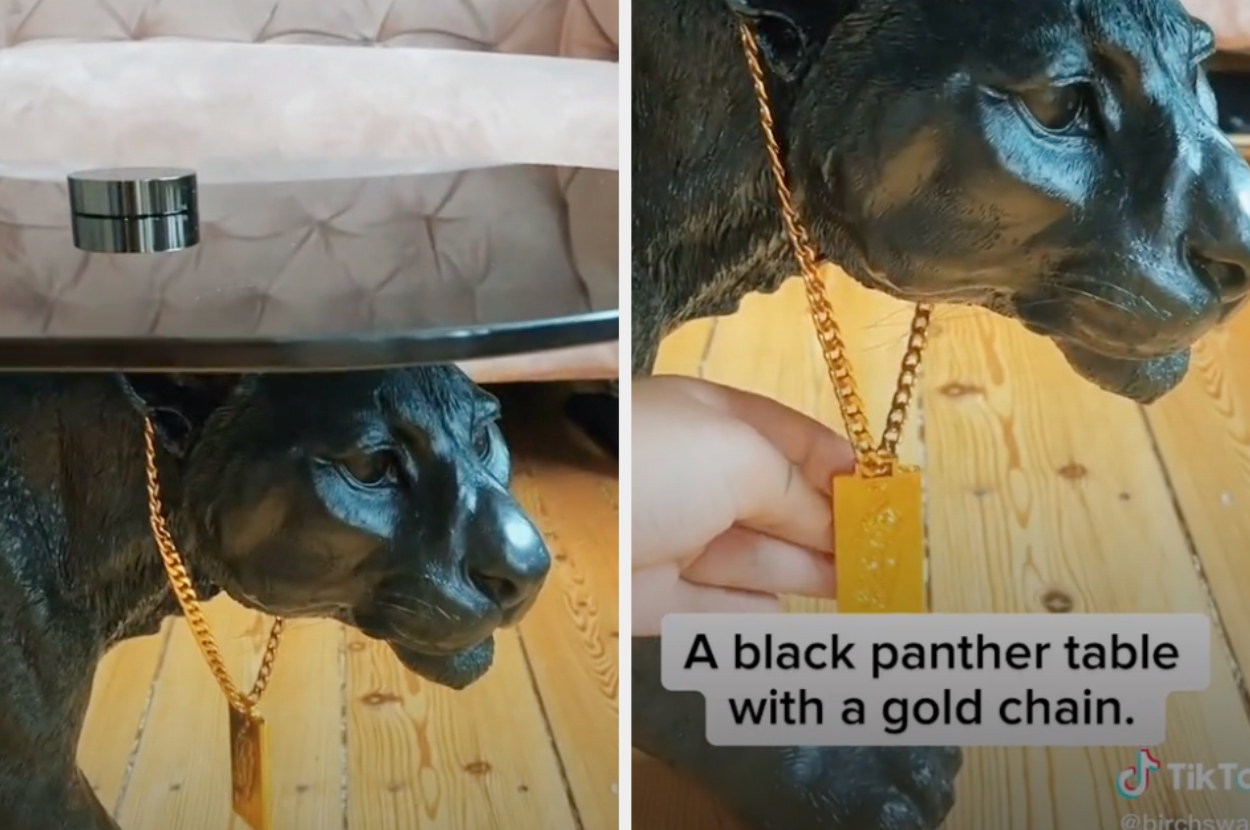A coffee table with a panther statue as its base, with a gold chain necklace around its neck