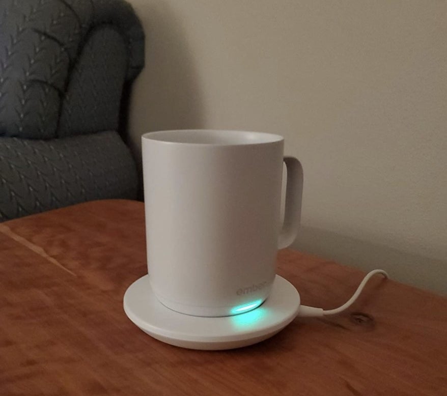 reviewer photo of the mug on its charging dock 