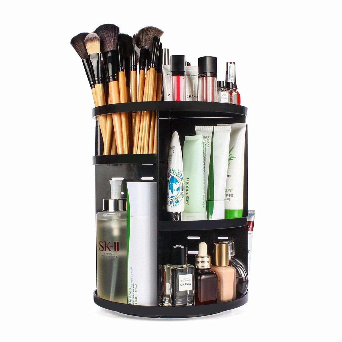 The rotating makeup organiser with makeup brushes, and other cosmetics stored in it.