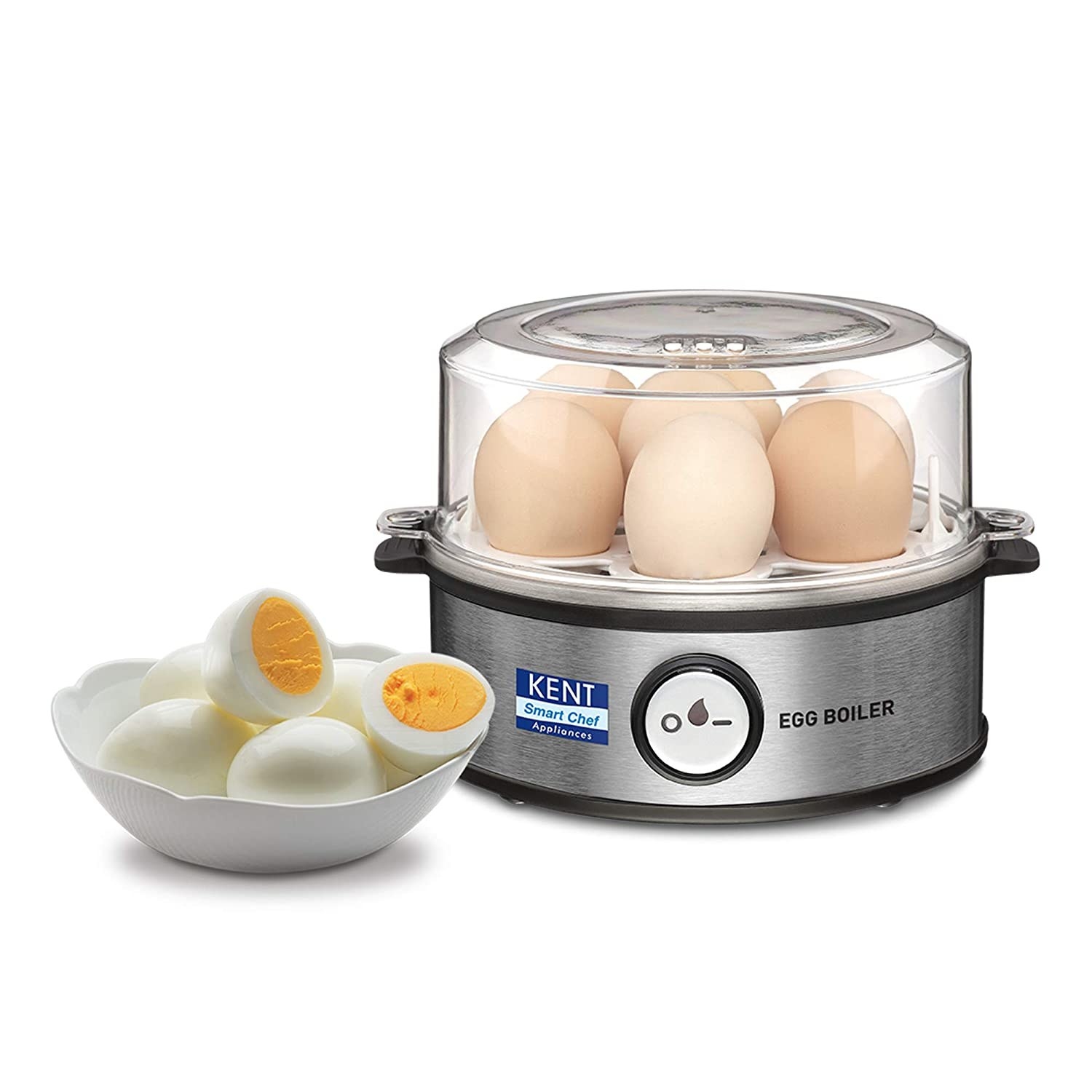 An egg boiler with eggs in it next to eggs in a bowl 