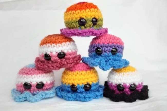 octopus-shaped beanies in various LGBT flag colors