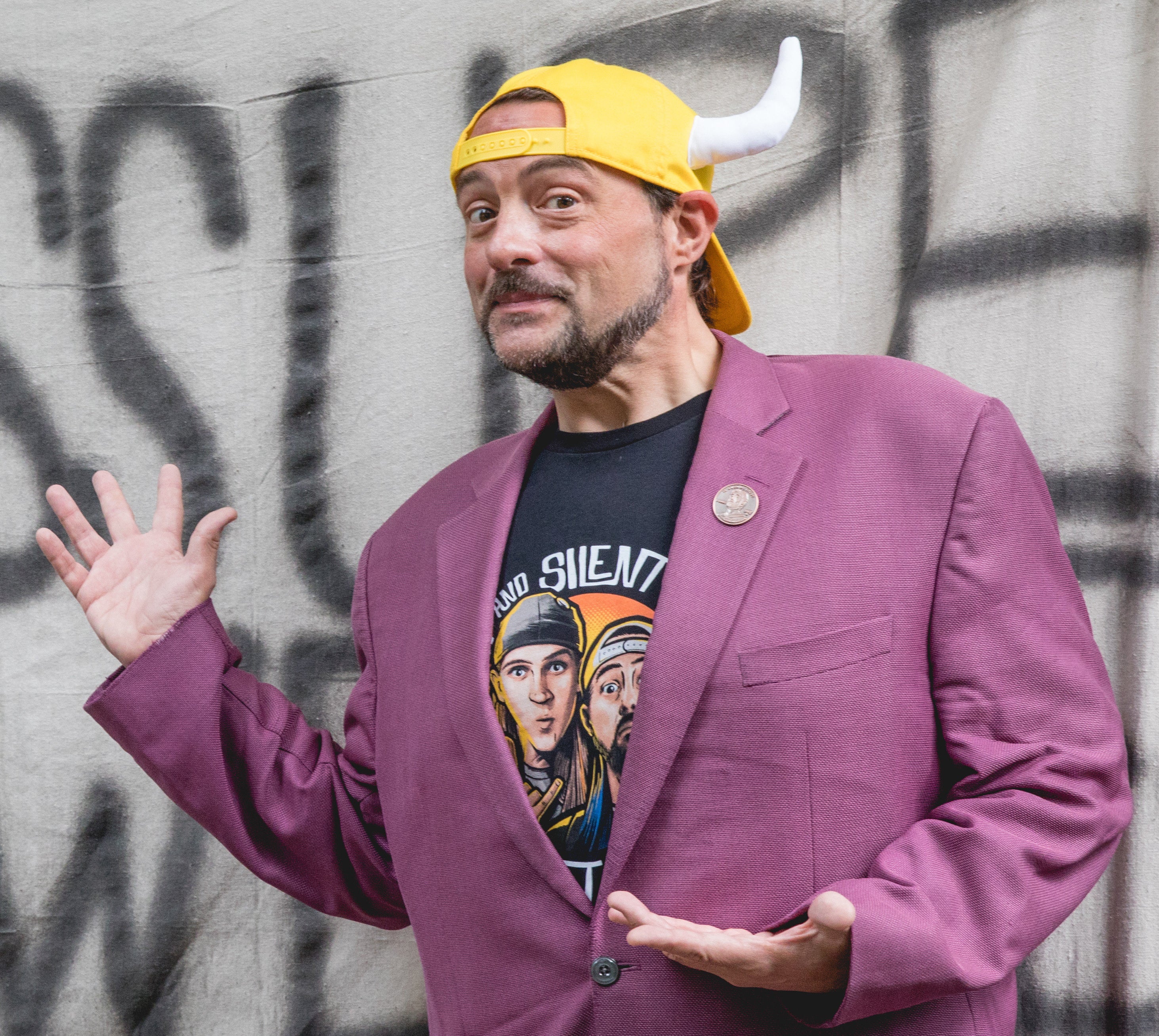 Kevin Smith in a purple suit jacket