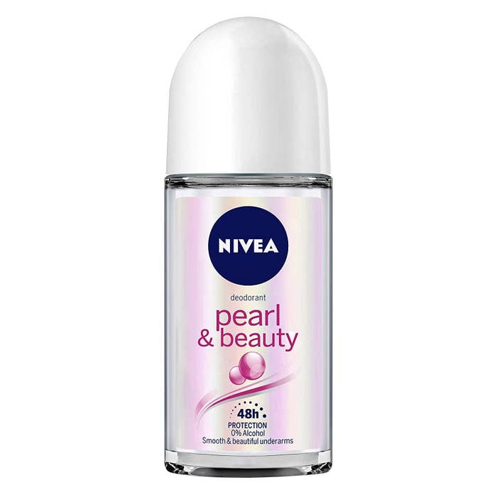 A small, pale white glass bottle of Nivea roll-on deodorant.  
