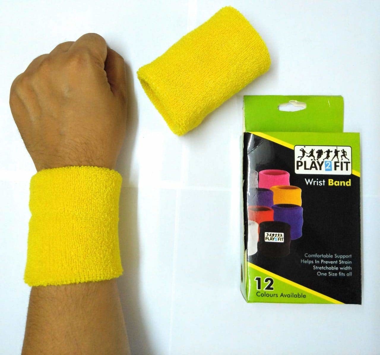 A yellow wrist band pictured on a person&#x27;s wrist.