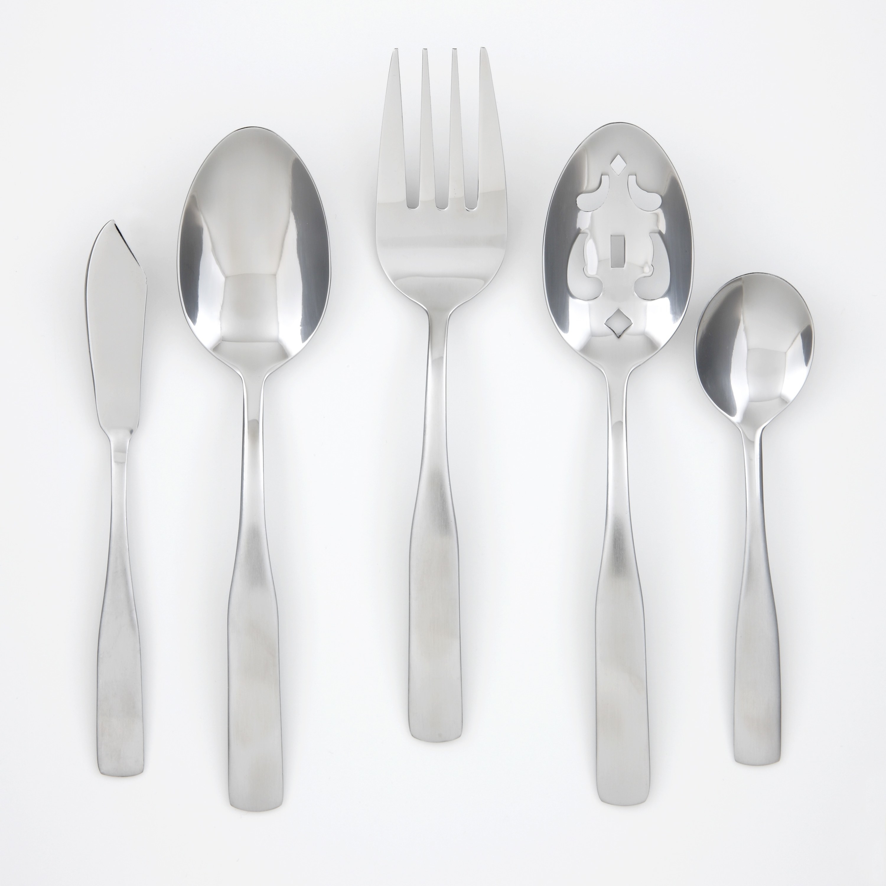 the flatware set including a spoon with decorative carved serving spoon